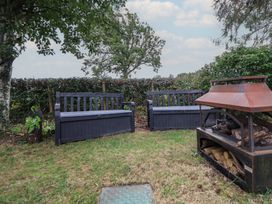 A garden with benches and a firepit at Delta Superior