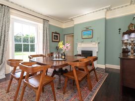 A dining room with a table and chairs at The Old Vicarage in St Issey