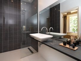 A bathroom with a shower and sink at The Old Vicarage in St Issey