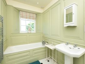 A bathroom with a bathtub and sink at The Old Vicarage St Issey