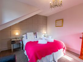 A bedroom with a bed and bedside table at The Boundary in Windermere