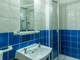 A bathroom with a sink and shower at The Boundary Windermere