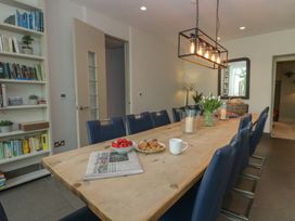 A dining room with a large table and chairs at The Boundary in Windermere