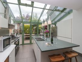 A kitchen with a countertop and refrigerator at The Boundary in Windermere
