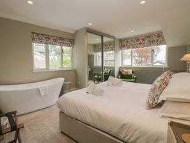 A bedroom with a bed and a bathtub at The Boundary in Windermere