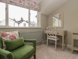 A bedroom with a mirror and desk at The Boundary in Windermere