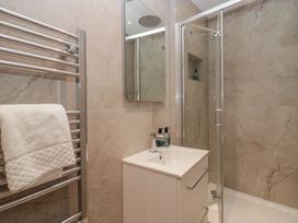 A bathroom with a shower and sink at The Boundary in Windermere