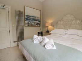 A bedroom with a bed and towels on it at The Boundary in Windermere