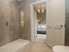 A bathroom with a shower and a view of a bedroom at The Boundary in Windermere