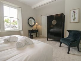 A bedroom with a bed and window at The Boundary in Windermere