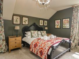 A bedroom with a bed and bedside tables at The Boundary in Windermere