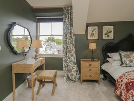 A bedroom with a bed and nightstand at The Boundary in Windermere