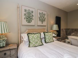 A bedroom with a bed and decorative pillows at The Boundary in Windermere