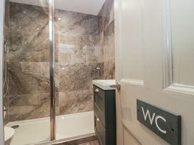 A bathroom with a shower and sink at The Boundary in Windermere