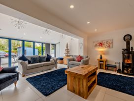 A living room with sofas and a coffee table at Sea Haze in Tenby