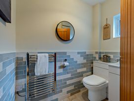 A bathroom with a sink and toilet at Sea Haze in Tenby