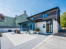 A house with patio and chairs at Sea Haze in Tenby