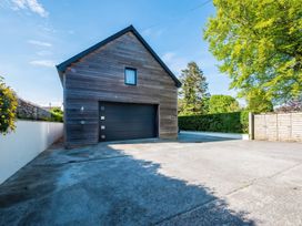 A house with a garage and driveway at Sea Haze in Tenby