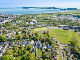 An aerial view of a coastal area with houses and fields at Sea Haze in Tenby