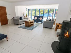 A living room with sofas and a coffee table at Sea Haze in Tenby