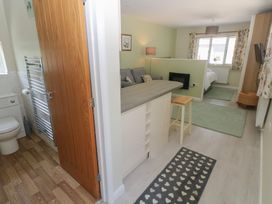 A bathroom with a toilet and sink at Sea Haze in Tenby