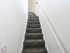 A staircase leading upwards at Salvin Cottage in Alston