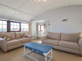 A living room with two sofas and a coffee table at The Loft in Truro