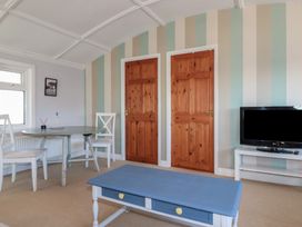A dining room with a table and chairs at The Loft in Truro