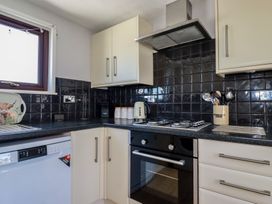A kitchen with appliances and utensils at The Loft in Probus