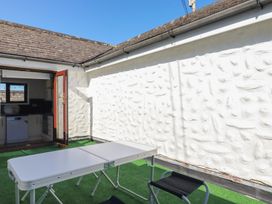 An outdoor area with a table and chairs at The Loft Probus