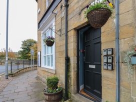 An entrance with a door and letterboxes at The Railway Apartment in Hexham