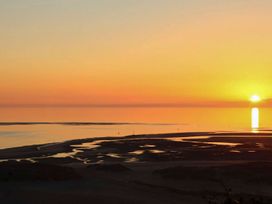 A sunset over the ocean at The Ingle in Barmouth