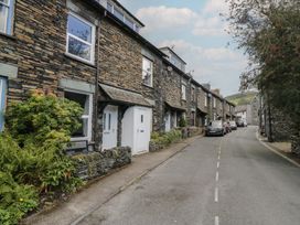 A street with stone houses and parked cars at Cloud Cottage Ambleside