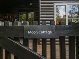 A sign for Moon Cottage at Moon Cottage White Cross Bay Holiday Park near Troutbeck Bridge