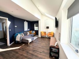 A living room with a sofa and armchairs at Hen Stablau in Dinmael near Cerrigydrudion