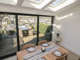 A dining room with a table and chairs at 36 Crowthers Hill in Dartmouth