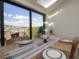 A dining room with a table set for a meal at 36 Crowthers Hill Dartmouth