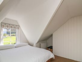 A bedroom with a bed and window at 36 Crowthers Hill in Dartmouth