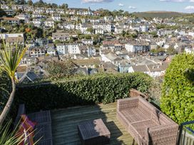 An outdoor seating area overlooking houses at 36 Crowthers Hill in Dartmouth