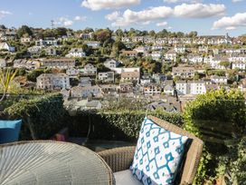 A patio with a view of houses on a hillside at 36 Crowthers Hill, Dartmouth