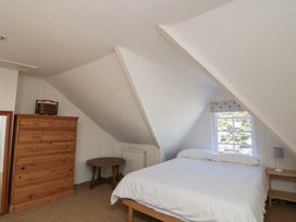 A bedroom with a bed and a chest of drawers at 36 Crowthers Hill in Dartmouth