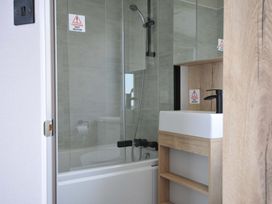 A bathroom with a shower and sink at Eden Way 47