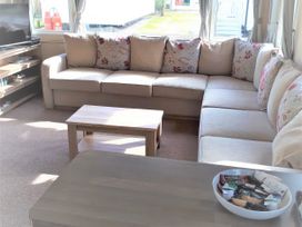 A living room with a sofa and coffee table at Par Sands Holiday Park - 6388 Par
