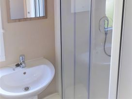 A bathroom with a sink and a shower at Par Sands Holiday Park - 6388 in Par