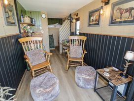 A snug with rocking chairs and side table at GiGi's Horsebox in Evesham