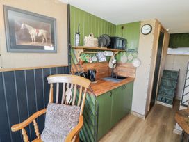 A kitchen with a sink and a microwave at GiGi's Horsebox in Evesham