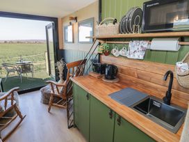 A kitchen with a sink and kettle at GiGi's Horsebox Evesham