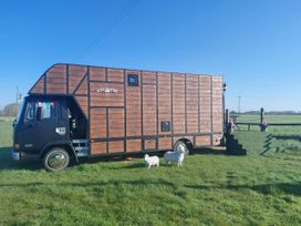 A horsebox parked on grass at GiGi's Horsebox Near Broadway