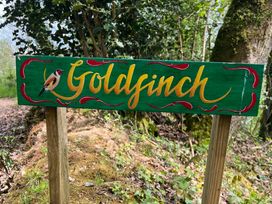 A sign with the name Goldfinch and a bird illustration at Goldfinch in Panson Mill near Ashwater