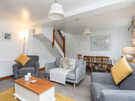 A living room with a sofa and coffee table at Bryn Bach in Pentraeth
